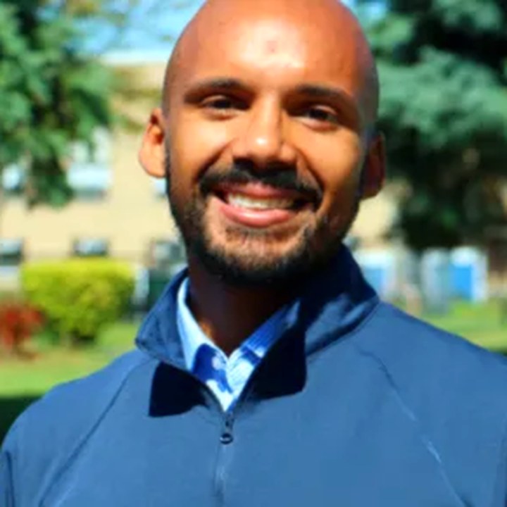 Hamilton Esteban, Licensed Mental Health Counselor, smiling outdoors